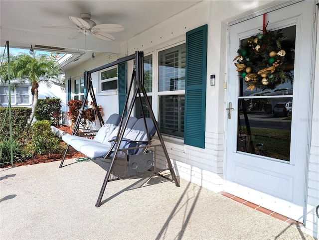 view of patio featuring ceiling fan