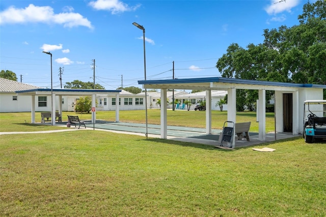 view of property's community with a yard