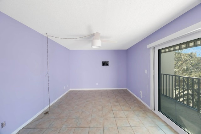 spare room with ceiling fan and a textured ceiling