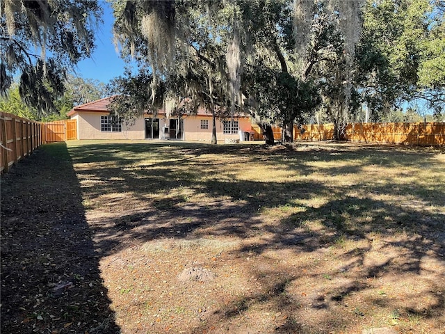 view of yard with a fenced backyard