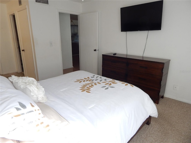 bedroom with carpet floors and a closet