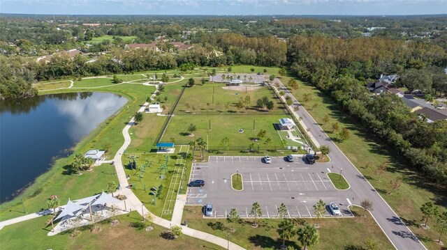 birds eye view of property with a water view