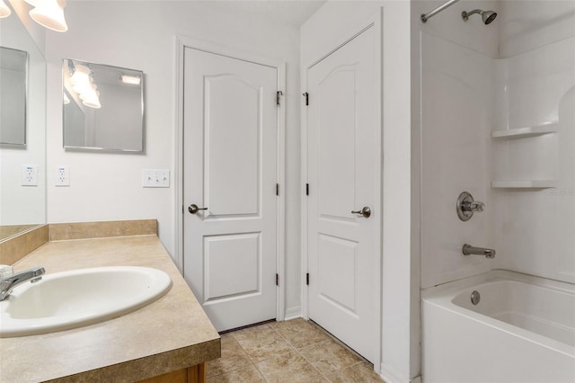 bathroom with bathtub / shower combination, vanity, and tile patterned flooring