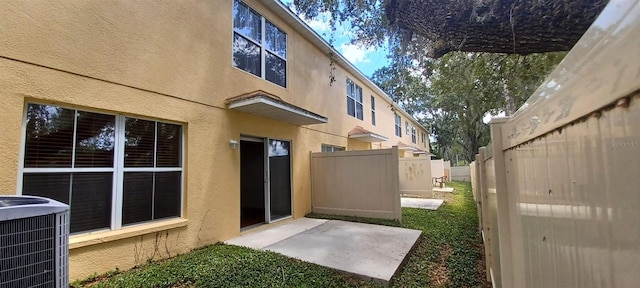 exterior space featuring central AC unit and a patio area