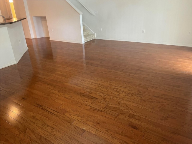 spare room with dark hardwood / wood-style flooring