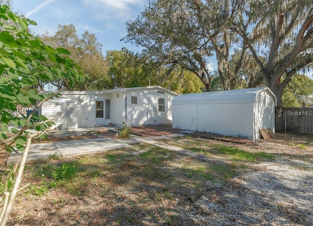 rear view of house with a shed