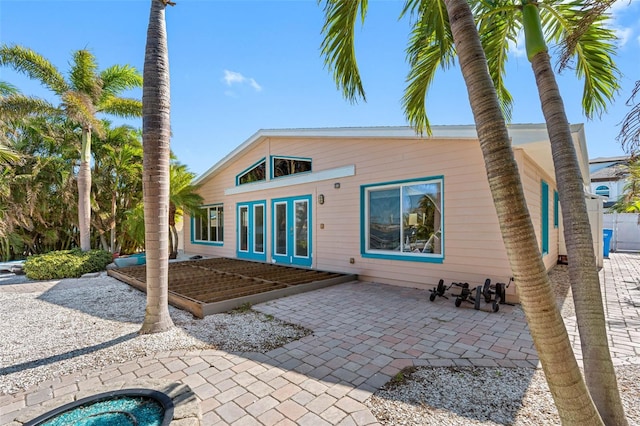 rear view of house featuring french doors and a patio