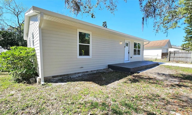 rear view of property with fence