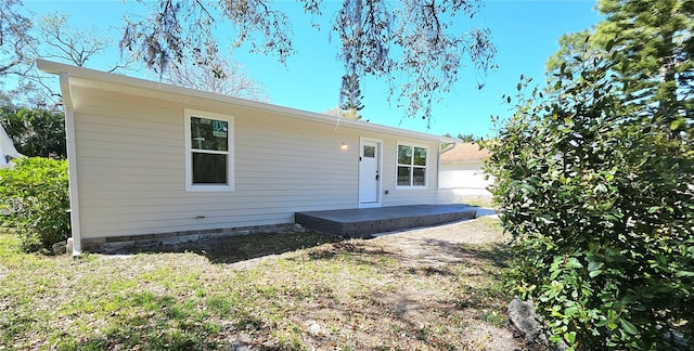 single story home featuring a patio area