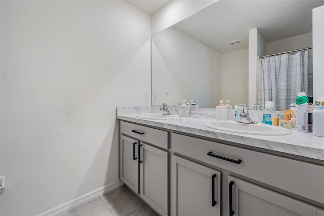 bathroom featuring tile patterned floors and vanity