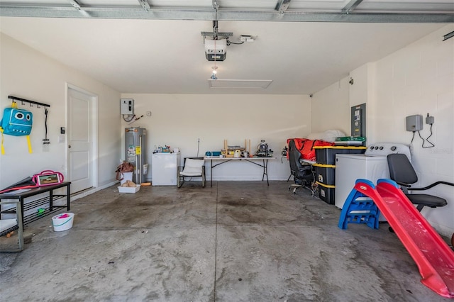 garage with white fridge, washer / dryer, electric water heater, and a garage door opener