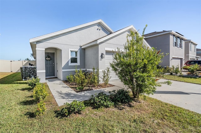 16838 Delia St, Wimauma, FL 33598 - view of front of property with a garage and stucco siding
