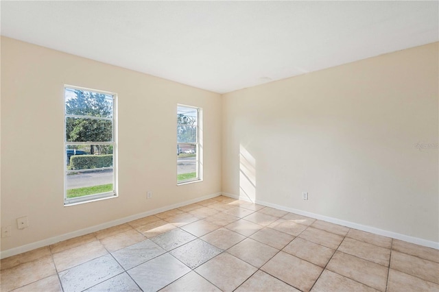 spare room with light tile patterned flooring