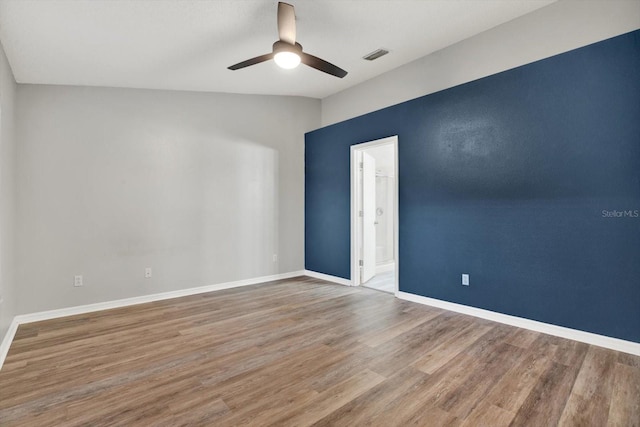 12612 Midpointe Dr, Riverview, FL 33579 - unfurnished room featuring wood finished floors, a ceiling fan, baseboards, and vaulted ceiling