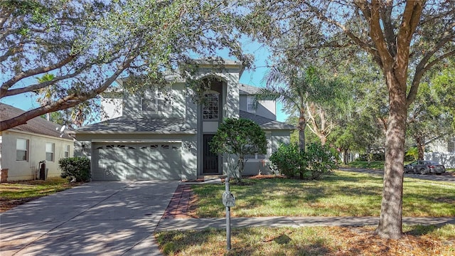 view of front of house featuring a garage and a front lawn