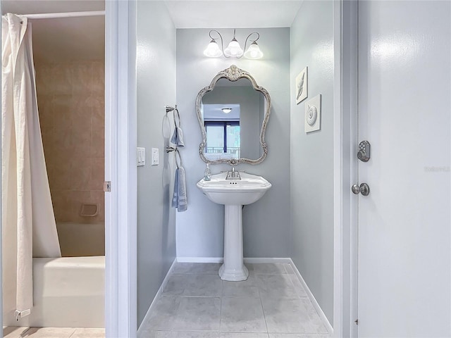 bathroom with tile patterned floors and shower / bathtub combination with curtain