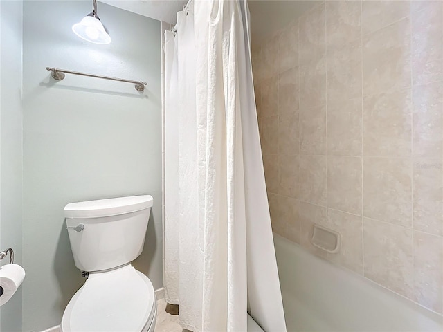 bathroom featuring toilet and shower / bathtub combination with curtain