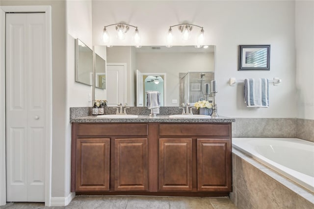 bathroom featuring vanity and separate shower and tub