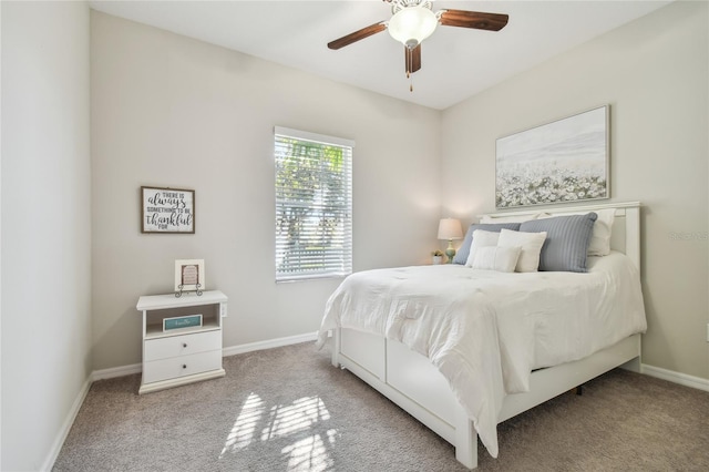 bedroom featuring light colored carpet and ceiling fan