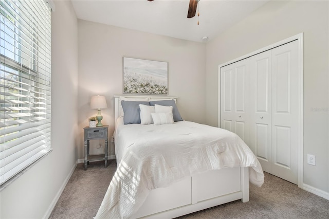 bedroom with carpet flooring, ceiling fan, and a closet