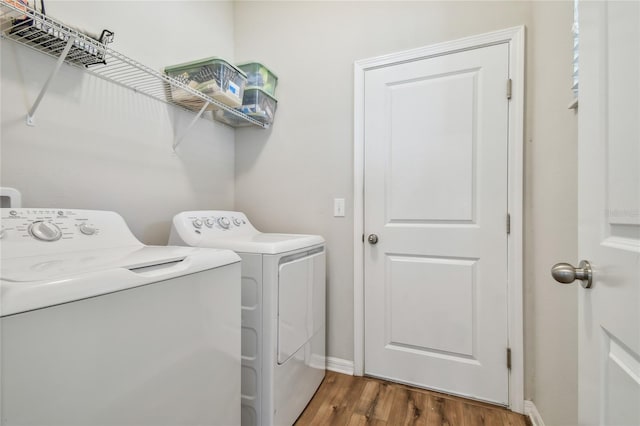 washroom featuring washer and dryer and dark hardwood / wood-style flooring