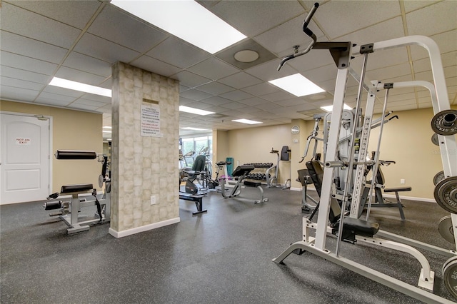 workout area featuring a drop ceiling