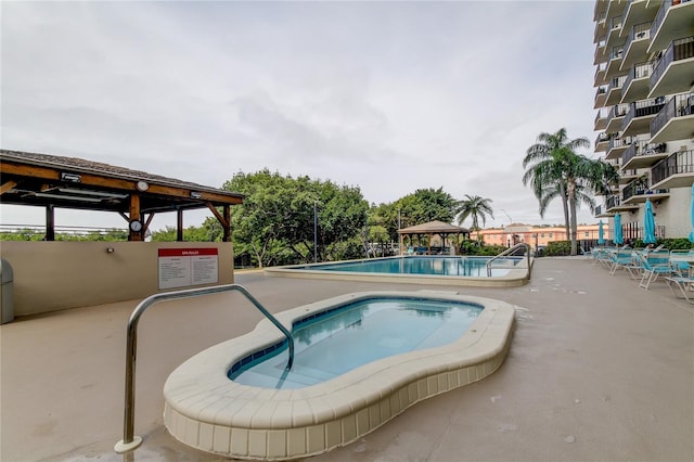 view of pool with a gazebo and a patio