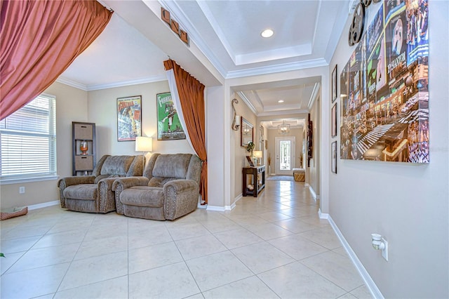 interior space with a raised ceiling, ornamental molding, and light tile patterned floors