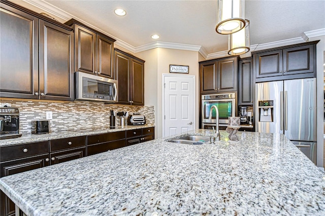 kitchen featuring sink, crown molding, dark brown cabinets, light stone counters, and stainless steel appliances