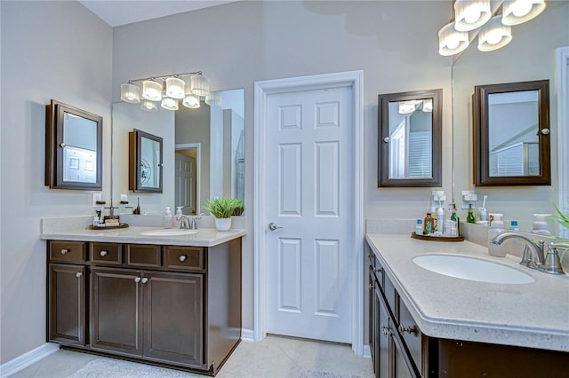 bathroom with tile patterned floors and vanity