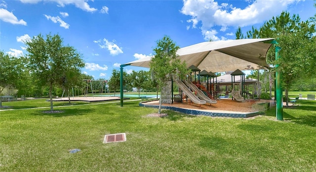 view of playground with a lawn