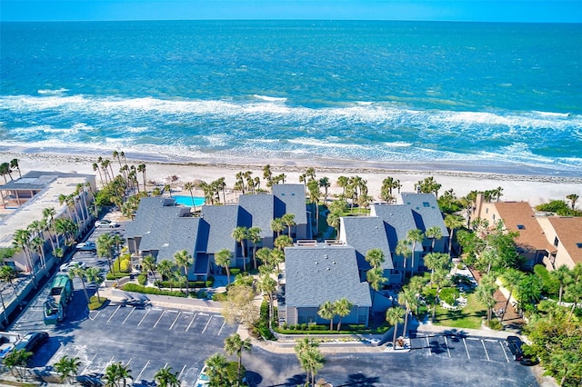 aerial view featuring a water view, a residential view, and a view of the beach