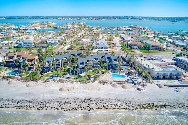 birds eye view of property with a residential view, a water view, and a beach view