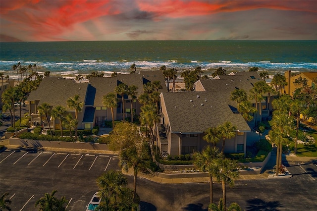 aerial view with a water view and a view of the beach