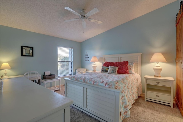 carpeted bedroom featuring ceiling fan, a textured ceiling, and lofted ceiling