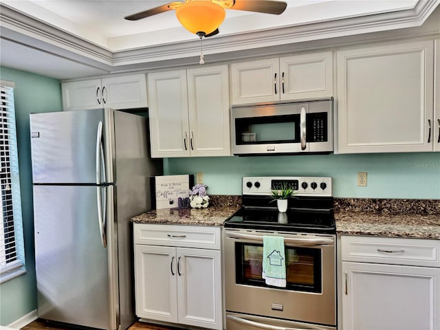 4452 Weybridge St Unit 74, Sarasota, FL 34235 - kitchen featuring stainless steel appliances, ceiling fan, dark stone countertops, and white cabinets