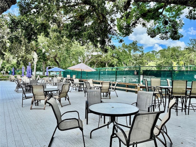 4452 Weybridge St Unit 74, Sarasota, FL 34235 - view of patio featuring outdoor dining area and view of scattered trees