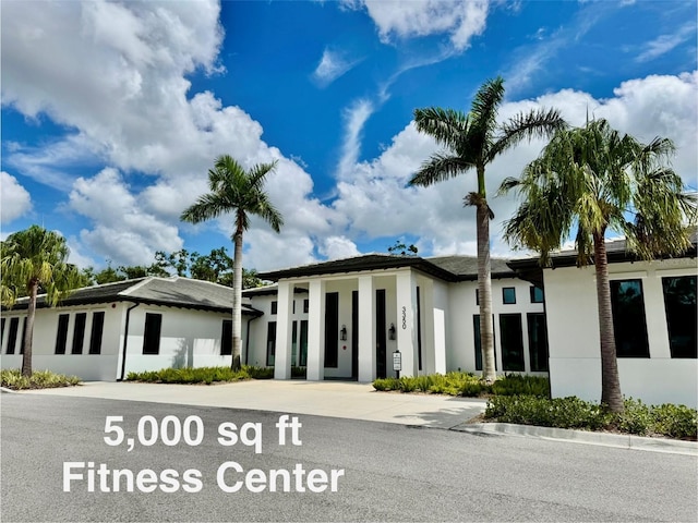 4452 Weybridge St Unit 74, Sarasota, FL 34235 - view of property featuring concrete driveway