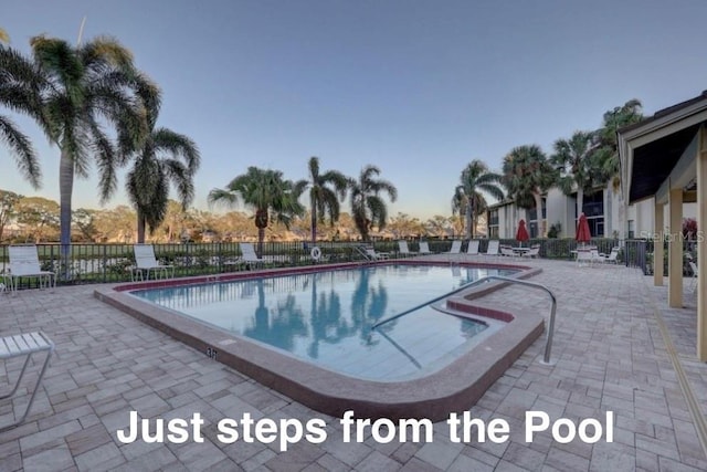 4452 Weybridge St Unit 74, Sarasota, FL 34235 - community pool featuring a patio area