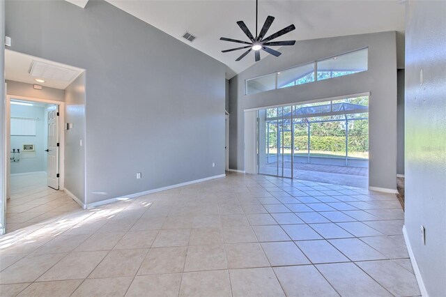 3125 Bent Creek Dr, Valrico, FL 33596 - spare room with high vaulted ceiling, light tile patterned floors, ceiling fan, and baseboards