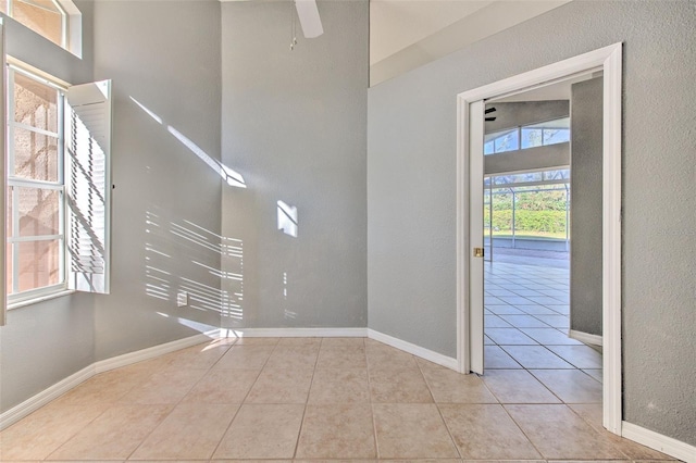 foyer entrance featuring ceiling fan and light tile patterned floors