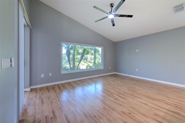 3125 Bent Creek Dr, Valrico, FL 33596 - empty room with vaulted ceiling, a ceiling fan, light wood-type flooring, and baseboards