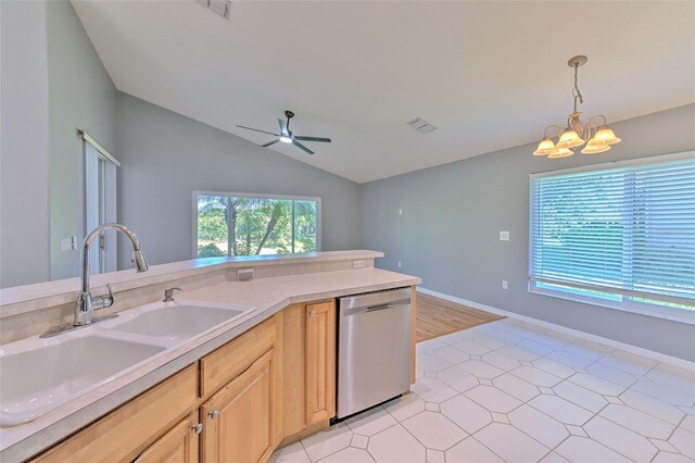 3125 Bent Creek Dr, Valrico, FL 33596 - kitchen featuring stainless steel dishwasher, a sink, a chandelier, a ceiling fan, and vaulted ceiling