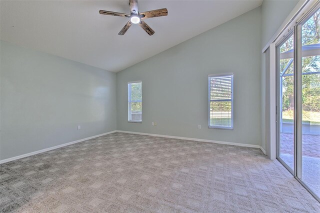 3125 Bent Creek Dr, Valrico, FL 33596 - spare room with light colored carpet, a ceiling fan, high vaulted ceiling, and baseboards