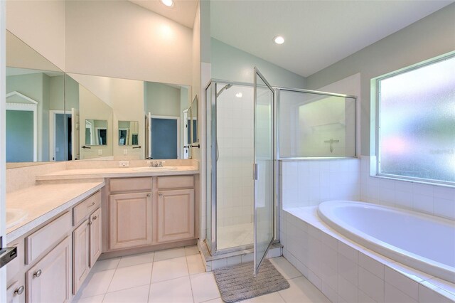 3125 Bent Creek Dr, Valrico, FL 33596 - full bathroom featuring double vanity, a garden tub, a stall shower, tile patterned floors, and recessed lighting