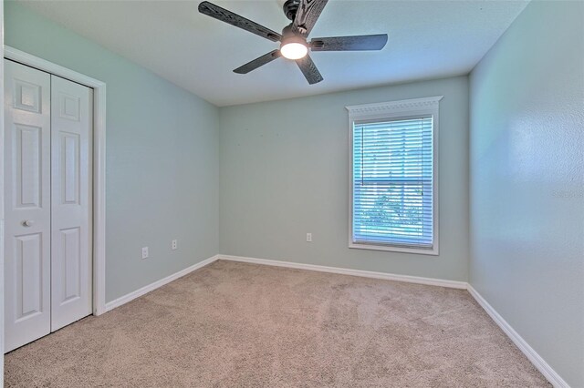 3125 Bent Creek Dr, Valrico, FL 33596 - unfurnished bedroom featuring carpet, a closet, baseboards, and ceiling fan