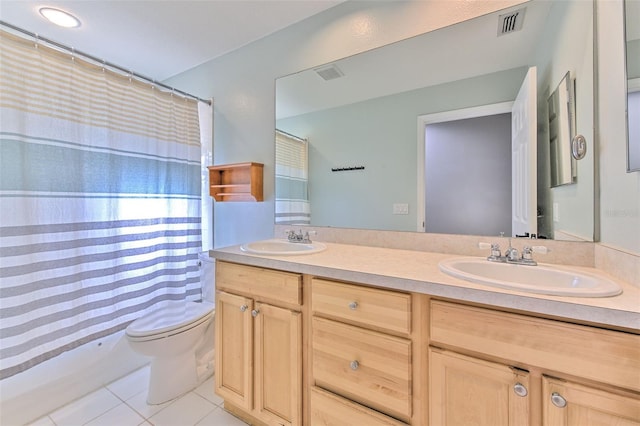 bathroom featuring a shower with curtain, tile patterned flooring, vanity, and toilet