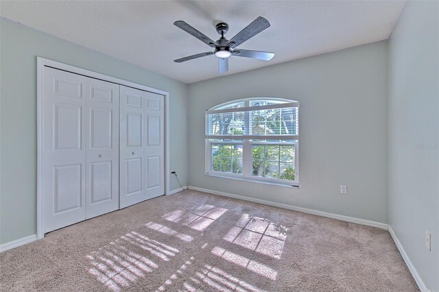 3125 Bent Creek Dr, Valrico, FL 33596 - unfurnished bedroom with carpet, baseboards, a closet, and a ceiling fan