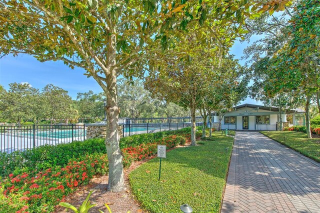 3125 Bent Creek Dr, Valrico, FL 33596 - surrounding community with a pool and driveway