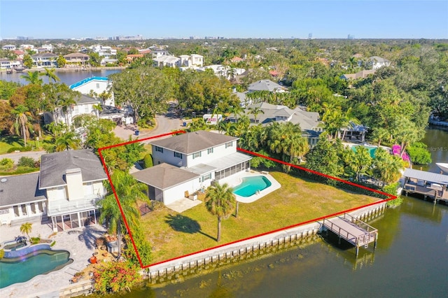 drone / aerial view with a water view and a residential view